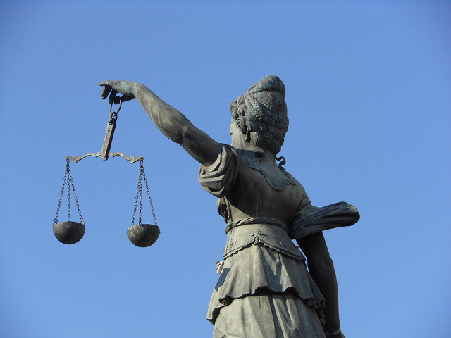 Statue of justice holding a balance
